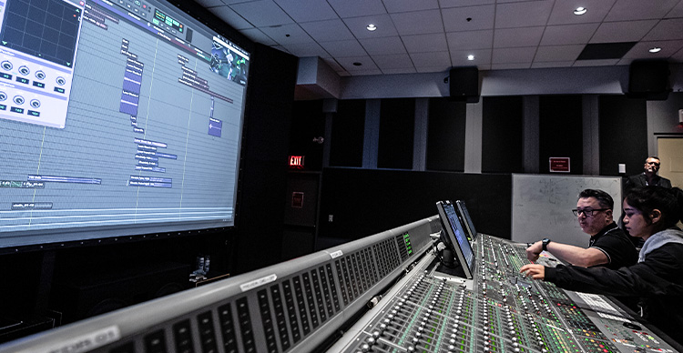 Sound Design for Visual Media students at Vancouver Film School using industry-standard equipment in a studio on-campus.
