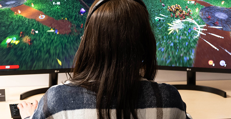 Game Design student at Vancouver Film School playtesting their custom-built video game.