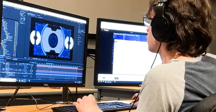 A VFS Digital Design student working on a creative project in one of the school's design labs.