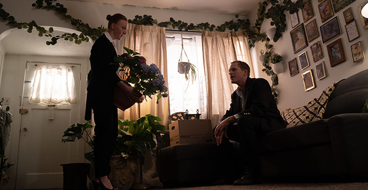Film still from The Beanstalk showing actors Lucas Tranch and Michaela Mackenzie during a tense scene.