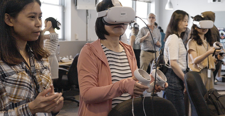 Group of people using VR equipment on the Vancouver Film School campus.