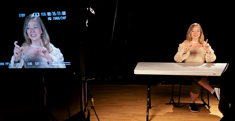 VFS Acting students in studio with official Vancouver Film School and theWorkbook logos displayed. 