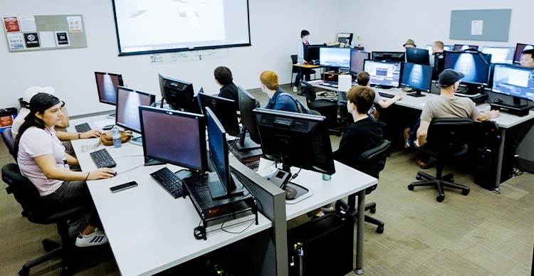 Vancouver Film School students collaborating on campus during hands-on creative training.