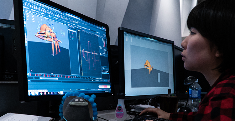 A Vancouver Film School student animating a 3D character using industry-standard animation software.